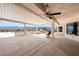 Covered patio overlooking a pool and mountains, complete with a built-in grill at 5450 Grain Mill Rd, Pahrump, NV 89061
