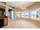 Bonus area featuring tile floors, ceiling fan and expansive windows with views of the mountains at 5450 Grain Mill Rd, Pahrump, NV 89061