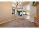 Spacious dining area features plush carpeting, neutral paint and easy access to the kitchen at 5450 Grain Mill Rd, Pahrump, NV 89061