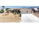 Beautiful home featuring a three-car garage, desert landscaping, and proximity to scenic mountain views at 5450 Grain Mill Rd, Pahrump, NV 89061