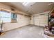Clean, empty garage with insulated walls, shelving, and overhead door at 5450 Grain Mill Rd, Pahrump, NV 89061