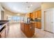 Bright kitchen with granite countertops, central island, and stainless steel appliances with views at 5450 Grain Mill Rd, Pahrump, NV 89061