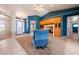 Large living room with tile and carpet flooring plus an ornate front door leading to the exterior at 5450 Grain Mill Rd, Pahrump, NV 89061