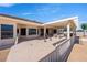 Covered back patio with built-in outdoor kitchen, grill, and dining area at 5450 Grain Mill Rd, Pahrump, NV 89061