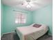 Comfortable bedroom with light blue walls, a ceiling fan, and a carpet at 5544 Cloudy Glen St, North Las Vegas, NV 89031