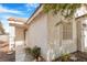 Close up of the front entrance showcasing a light-colored door, pillars and a window at 5544 Cloudy Glen St, North Las Vegas, NV 89031