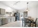 Kitchen with stainless steel appliances, eat-in dining area, and sliding glass doors at 5544 Cloudy Glen St, North Las Vegas, NV 89031