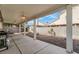 Outdoor patio space featuring a ceiling fan, hardscape and block wall at 5544 Cloudy Glen St, North Las Vegas, NV 89031