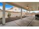 Outdoor patio space featuring a ceiling fan, hardscape and block wall at 5544 Cloudy Glen St, North Las Vegas, NV 89031