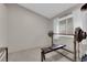 This bedroom has ample natural light, and includes a weight training bench and rack at 5884 Deer Valley Dr, Las Vegas, NV 89156