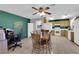 Eat-in kitchen with tile flooring, wood table, and appliances, perfect for Gathering meals and entertaining at 5884 Deer Valley Dr, Las Vegas, NV 89156