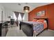 Cozy bedroom with a dark wood sleigh bed, a decorative pendant light, and a modern desk at 605 Devonhall St # 202, Las Vegas, NV 89145