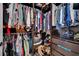 Spacious walk-in closet with organized shelving, hanging rods, and ample storage for clothing and accessories at 605 Devonhall St # 202, Las Vegas, NV 89145