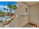 The front door with a security gate opens to the property, offering privacy and security in a complex with a pool at 605 Devonhall St # 202, Las Vegas, NV 89145