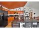Kitchen featuring black countertops, bright cabinetry, stainless steel appliances, and a spacious island at 605 Devonhall St # 202, Las Vegas, NV 89145