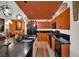 Stylish kitchen with island, black countertops, modern appliances and creative fixtures creates an inviting ambiance at 605 Devonhall St # 202, Las Vegas, NV 89145