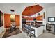 Eat-in kitchen has sleek black countertops, a kitchen island with bar seating and creative lighting fixtures at 605 Devonhall St # 202, Las Vegas, NV 89145
