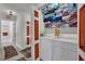 Neat laundry room equipped with a washer, dryer, and storage shelves, plus access to the bathroom at 605 Devonhall St # 202, Las Vegas, NV 89145