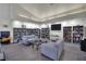 Library with ample bookshelves, cozy seating, and a flat screen tv at 605 Devonhall St # 202, Las Vegas, NV 89145