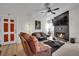Comfortable living room featuring a fireplace, TV, and a cozy atmosphere enhanced by the light wood flooring at 605 Devonhall St # 202, Las Vegas, NV 89145