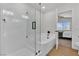 Bathroom with a bathtub, separate shower, and open doorway at 6282 Dollar Bill Ct, Las Vegas, NV 89141