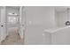 Bright hallway with neutral carpet leading to other rooms, offering a seamless transition throughout the home at 6282 Dollar Bill Ct, Las Vegas, NV 89141