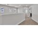 Hallway with carpet, bright white walls, with door openings showing lots of light at 6282 Dollar Bill Ct, Las Vegas, NV 89141