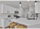 Stylish kitchen with white cabinetry, stainless steel appliances, and a sleek countertop at 6282 Dollar Bill Ct, Las Vegas, NV 89141