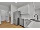 Galley kitchen featuring stainless steel appliances and bright countertops at 6282 Dollar Bill Ct, Las Vegas, NV 89141