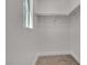 Bright walk-in closet with carpeted floor, shelf, and rod for organizing clothing at 6282 Dollar Bill Ct, Las Vegas, NV 89141