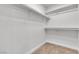 Walk-in closet with carpeted floor, and shelving for organized storage at 6282 Dollar Bill Ct, Las Vegas, NV 89141