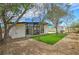 Beautiful backyard with green lawn, mature trees, and a modern home design at 6320 Dayton Ave, Las Vegas, NV 89107