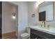 Bathroom featuring a modern vanity with gold hardware, toilet, and a doorway, a functional space at 6320 Dayton Ave, Las Vegas, NV 89107