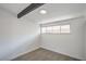 Bright bedroom with a beam accent, window, and carpeted floors, offering a cozy and inviting space at 6320 Dayton Ave, Las Vegas, NV 89107