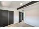 Comfortable bedroom featuring a ceiling fan, beam accent, and spacious closet for storage solutions at 6320 Dayton Ave, Las Vegas, NV 89107