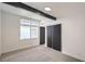 Bright bedroom with window, beam accent, and closet, offering a serene and functional living space at 6320 Dayton Ave, Las Vegas, NV 89107