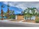 Home with desert landscaping, modern fencing, and drought-tolerant greenery, creating curb appeal at 6320 Dayton Ave, Las Vegas, NV 89107