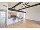 Well-lit kitchen featuring modern stools and black countertops at 6320 Dayton Ave, Las Vegas, NV 89107