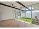 Bright living room with floor-to-ceiling windows overlooking the backyard at 6320 Dayton Ave, Las Vegas, NV 89107