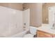 A well lit bathroom has a shower, toilet and vanity at 6620 Tulip Falls Dr, Henderson, NV 89011