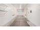 A spacious two car garage includes shelving units at 6620 Tulip Falls Dr, Henderson, NV 89011