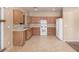 Spacious kitchen with ample cabinet space and white appliances at 6620 Tulip Falls Dr, Henderson, NV 89011