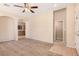 Inviting living room with carpeted floors and access to the kitchen at 6620 Tulip Falls Dr, Henderson, NV 89011
