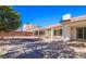 Spacious backyard with covered patio and desert landscaping, perfect for outdoor entertaining at 708 Canyon Country Cir, Henderson, NV 89002