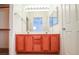 Bathroom featuring double sinks, wood cabinets, and a large mirror at 708 Canyon Country Cir, Henderson, NV 89002