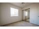 A basic bedroom features a window, and a closet with mirrored sliding doors at 708 Canyon Country Cir, Henderson, NV 89002