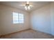 Bright, cozy bedroom with carpet, ceiling fan, and a window providing natural light at 708 Canyon Country Cir, Henderson, NV 89002