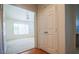 View from entryway into a carpeted bedroom space with window and ceiling fan at 708 Canyon Country Cir, Henderson, NV 89002