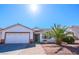 Inviting single-story home with a well-maintained yard, garage, and desert landscaping at 708 Canyon Country Cir, Henderson, NV 89002