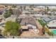Aerial shot of a backyard with a spa, patio cover, and privacy fence perfect for relaxation and entertaining at 7139 Mountain Moss Dr, Las Vegas, NV 89147